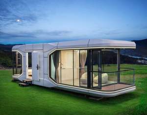 Maison capsule préfabriquée moderne, petite et modulaire, pour jardin, avec structure en aluminium thermolaqué et verre transparent, chambre et salon. - Product Image 6