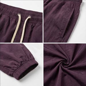 Pantalones informales de gran tamaño para hombre OEM, pantalones de chándal para hombre, pantalones de poliéster de nailon liso, pantalones de trabajo para correr para hombre - Product Image 4