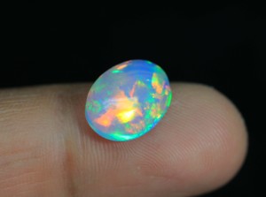 Magnifique opale éthiopienne cabochon Welo, opale brillante arc-en-ciel, forme ovale, pierre pour la création de bijoux - Product Image 1