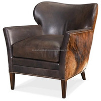Fauteuil en cuir de luxe avec structure robuste, assise confortable et rembourrée, design élégant, parfait pour le salon ou la salle de séjour.