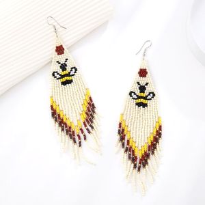 Pendientes de cuentas de arroz pequeñas de estilo étnico europeo y americano, con borlas largas de animales tejidas a mano. - Product Image 3