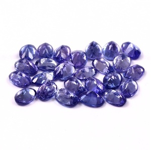 พลอยแทนซาไนต์สีน้ำเงินทรงรีขนาด 7x5 มม. พลอยธรรมชาติจาก HASNAIN GEMS  มีเอฟเฟกต์เพลโอโครอิก น้ำหนัก 1.00 กะรัต - Product Image 1