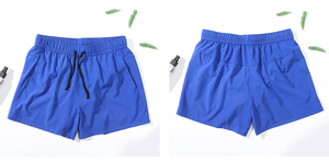 Short de bain pour homme bleu à séchage rapide, taille élastique, avec poches, en polyester tricoté, couleur unie, longueur mi-cuisse, cordon de serrage - Product Image 1