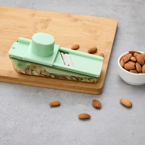 Innovative dry <b>fruit</b> slicer with stainless steel blade and storage container multipurpose nut cutting <b>tool</b> for kitchen use - Product Image 1