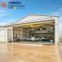 Structure de hangar robuste à ossature métallique, grande portée, pour stockage aéronautique, maintenance d'avions, stationnement de jets privés, utilisation aéroportuaire