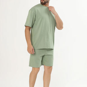 Conjunto de camiseta y pantalones cortos de algodón verde sólido para hombre, cuello redondo, ropa informal de verano, tela de punto transpirable - Product Image 1