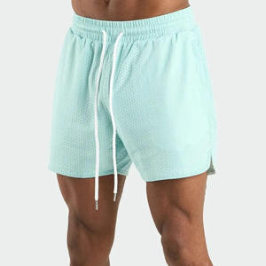 Shorts de sport en maille pour homme à prix réduit, anti-plis à l'avant, avec cordon de serrage et dentelle décorative, couleur unie, pour l'entraînement et le fitness - Product Image 1