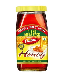 Miel pur sauvage Dabur, édulcorant naturel liquide en pot plastique pour la santé et le bien-être quotidien, sans sucre ajouté - Product Image 1