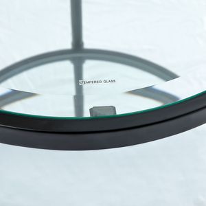 Elegante tavolino minimalista con piano in vetro temperato cristallino e cornice industriale nero opaco - Product Image 4