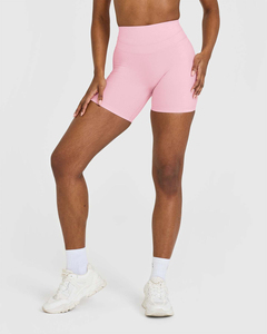 Shorts unis rose pétale uniques pour femmes, taille haute, avec ceinture compressive et tissu performant anti-transpiration - Product Image 1