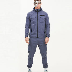 Conjunto Deportivo de Invierno Personalizado con Logotipo, Chaqueta Cortavientos Elástica y Pantalones de Chándal de Nailon para Entrenamiento - Product Image 1