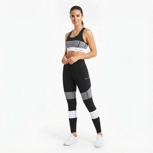 Ensemble de sport deux pièces pour femme : soutien-gorge de sport color block noir et gris et leggings taille haute pour fitness et entraînement - Product Image 1