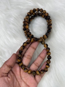 สร้อยข้อมือหินไทเกอร์อายธรรมชาติขนาด 8 มม. คุณภาพพรีเมียม ขัดเงาอย่างดี สร้อยข้อมือลูกปัดอัญมณี ขายส่งจำนวนมาก ของขวัญเครื่องประดับคริสตัล - Product Image 1