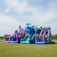 Château gonflable géant de qualité supérieure avec toboggan et mur d'escalade, coloré, pour location commerciale