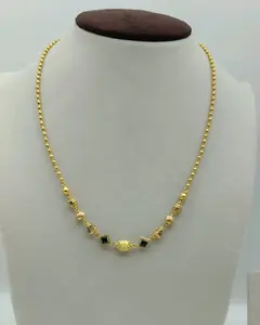 Joyería Fina Sofisticada Amarilla para Mujer, Collar de Perlas Doradas con Ónix Negro, Estaciones Geométricas y Detalles Texturizados Ornamentados - Product Image 1