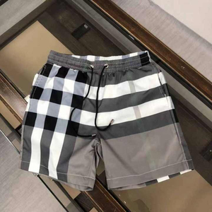 Nouveaux shorts de plage amples pour hommes, grande taille, personnalisables avec logo de designer, en toile unie, séchage rapide, respirants, imperméables et anti-UV - Product Image 3