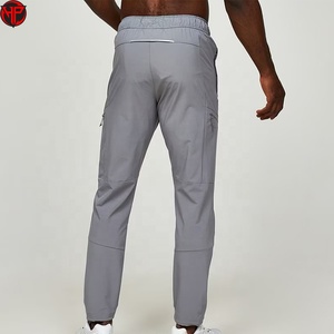 Pantalones cortavientos personalizados al por mayor para hombre, ajustados, 100% poliéster, nailon, pantalones cortavientos para hombre - Product Image 4