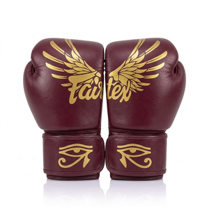 นวมชกมวยหนังแท้ Fairtex สีเบอร์กันดี พร้อมลายปีกสีทองและลายดวงตาแห่งฮอรัส แบบผูกเชือกที่ข้อมือ สำหรับฝึกซ้อมในยิม - Product Image 1