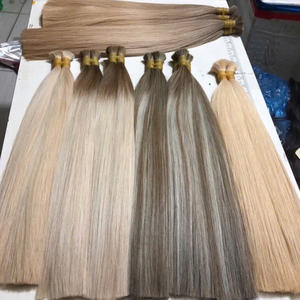 โรงงานผลิตผมต่อตรงแบบขายส่ง ผมตรงธรรมชาติ เรียงเกล็ดผมอย่างดี  แบบเย็บสองชั้นด้วยเครื่องจักร - Product Image 1