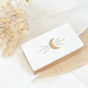 Marble box handcrafted from sustainably mango wood with a marble lid features a brass lunar crescent moon Storage Boxes - Product Image 1