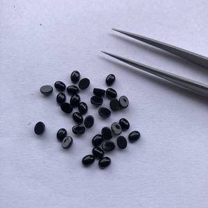 Onyx noir naturel ovale cabochon, pierre précieuse en vrac 4mm-5mm calibrée pour la fabrication de bijoux, vente en gros - Product Image 1