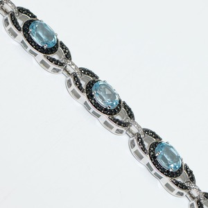 Exquisita Pulsera de Plata de Ley 925 con Baño de Rodio y Cristal Azul Cielo con Halo en Espiral de Circonita Negra para Mujer - Product Image 1