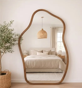 Beautiful organic puddle-shaped wooden floor <b>mirror</b>. Fluid asymmetrical frame adds warmth. Available at wholesale price. - Product Image 1
