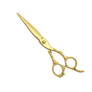 Ciseaux de coiffure en acier inoxydable allemand, lames affûtées dorées, pour usage domestique et professionnel. - Product Image 1
