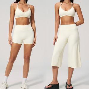 Customized Yoga Fitness Workout Gym Active Wear Women Bra with Shorts Halter Neck Sports Bra with Flare <b>Pants</b> Set for Woman - Product Image 1