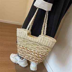 กระเป๋าสะพายทรงถังสานลายฉลุสไตล์วินเทจแฟชั่นใหม่สำหรับผู้หญิง เหมาะสำหรับการเดินทางในช่วงฤดูร้อน - Product Image 1