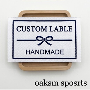 Étiquettes tissées pliées sur le côté avec logo personnalisé, en tissu damassé de qualité supérieure, pour vêtements de sport et marquage de vêtements, vente en gros usine - Product Image 3