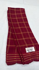 A lightweight, semi-sheer fabric with a slightly crinkled texture A pattern <b>formed</b> by intersecting horizontal and vertical lines - Product Image 3