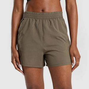 Shorts de punto de color liso con cintura alta para mujer, con cintura elástica y bolsillos, ajuste informal transpirable - Product Image 1