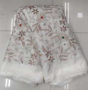 Exclusif pour les robes de soirée et les saris de luxe en tissu filet 100% soie enduite de PA, richement ornés de broderies Cutdana, conçus pour la confection de vêtements à motifs. - Product Image 1