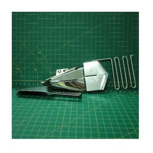 Reliure et dossier de pièces de machine à coudre industrielle fabriquée à Taiwan de 1 à 1/16 pouces S124-A pour une utilisation vestimentaire - Product Image 1