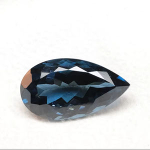 พลอยโทแพซลอนดอนแท้ - รูปทรงลูกแพร์ขนาด 16x12 มม. เจียระไนเหลี่ยม สีน้ำเงินเข้ม สำหรับทำเครื่องประดับ - Product Image 1