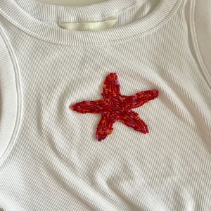 เสื้อครอปปักลูกปัดสไตล์ชาติพันธุ์สุดเก๋-งานแฮนด์เมด ปรับแต่งสี/ขนาดได้ NOVA STAR CRAFT ดีไซน์ทันสมัย - Product Image 1