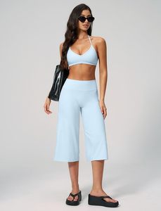 Ensemble de yoga 2 pièces bleu clair, haut court dos nu à col en V profond et pantalon taille haute mi-mollet, sans couture, en Spandex et Polyester - Product Image 2
