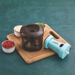 Compact manual food <b>chopper</b> with durable plastic body and sharp stainless steel blades for effortless <b>vegetable</b> and fruit - Product Image 3