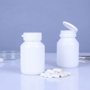Bouteille ronde en PEHD de 100 ml blanche pour médicaments, avec bouchon à clapet facile à ouvrir, pour pilules et compléments alimentaires, fabrication OEM/ODM, usine du Vietnam - Product Image 3