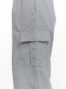 Pantalon cargo gris taille mi-haute personnalisé avec logo pour femme, coupe ample, en nylon coupe-vent, effet délavé, style parachute, idéal pour le printemps - Product Image 6