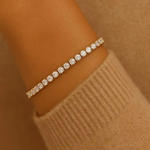 Pulsera de tenis de moissanita de lujo, tono dorado, con piedras de corte redondo minimalistas, elegante, delgada y apilable, pieza de joyería para uso diario - Product Image 1