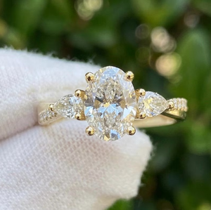 Sparkledge Creation LR-28 Durable 3CT Oval Lab Grown Diamond Three <b>Stone</b> Engagement <b>Ring</b> E VVS2 Pear Accent Gold IGI Certified - Product Image 1