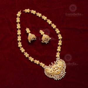 Intricate Laxmi Haram with Matte Gold Polish and Pearl Earrings - Product Image 1