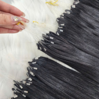 Dernière invention : Extensions de cheveux humains H6 à ligne invisible, cuticules alignées, micro-boucles, tissage à la main, effet plume.