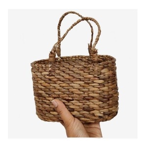 New Trendy Eco-Friendly Foldable Seagrass Hand Woven Straw Raffia Storage Basket Bags for Women Cosmetics - Product Image 1