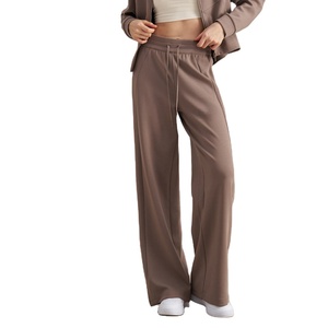Pantalon de yoga évasé taille mi-haute avec couche d'air confortable, cordon de serrage à la taille et poches, motif uni, en toile, style jogger - Product Image 1