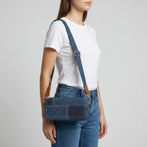 Denim Crossbody Bag With <b>Adjustable</b> <b>Strap</b> And Zipper Closure In Blue And Black Colors - Product Image 1