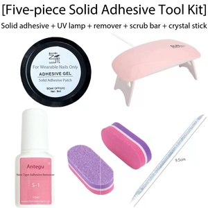 Five Piece Solid Adhesive <b>Nail</b> <b>Tool</b> Kit With UV Lamp Remover Scrub Bar And Crystal Stick For Wearable <b>Nails</b> - Product Image 3