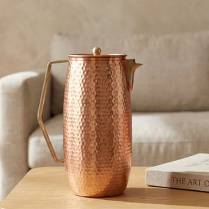 Elegant made in India cylindrical <b>copper</b> water pitcher featuring geometric <b>handles</b>, available at wholesale prices. - Product Image 1